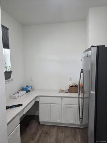 a kitchen with a sink appliances and cabinets