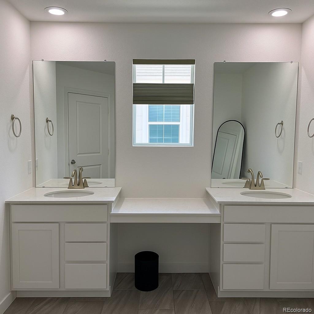 17350 Gandy Dancer Lane Parker, CO 80134 - Photo 14 of 33 a bathroom with a sink and a mirror