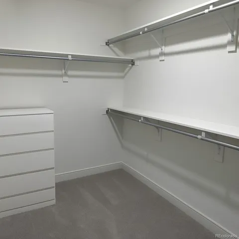a view of an empty walk in closet
