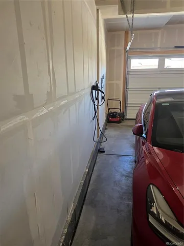 a view of an chairs and deck in the balcony