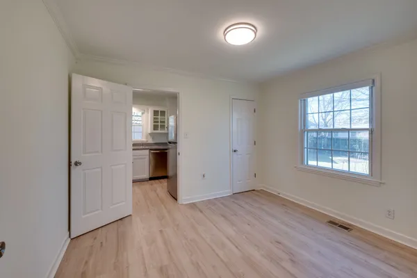 a white toilet sitting next to a bathroom sink and vanity