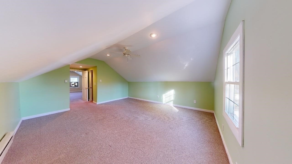 17 Gorham Road, Unit 2 Medford, MA 02155 - Photo 29 of 37 a view of a hallway with wooden floor and a living room