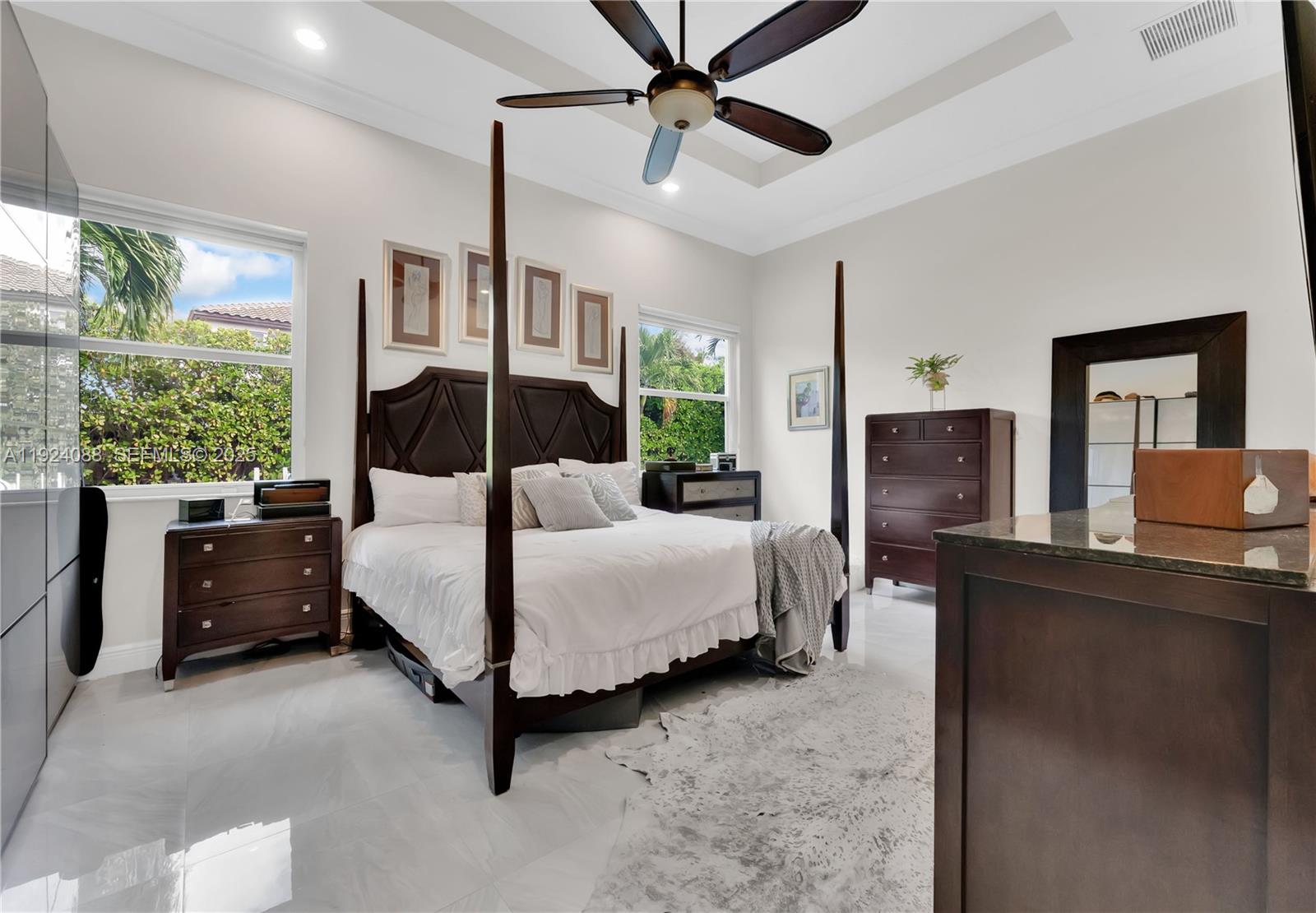 14929 Southwest 176th Terrace Miami, FL 33187 - Photo 15 of 38 a bedroom with a bed and large window