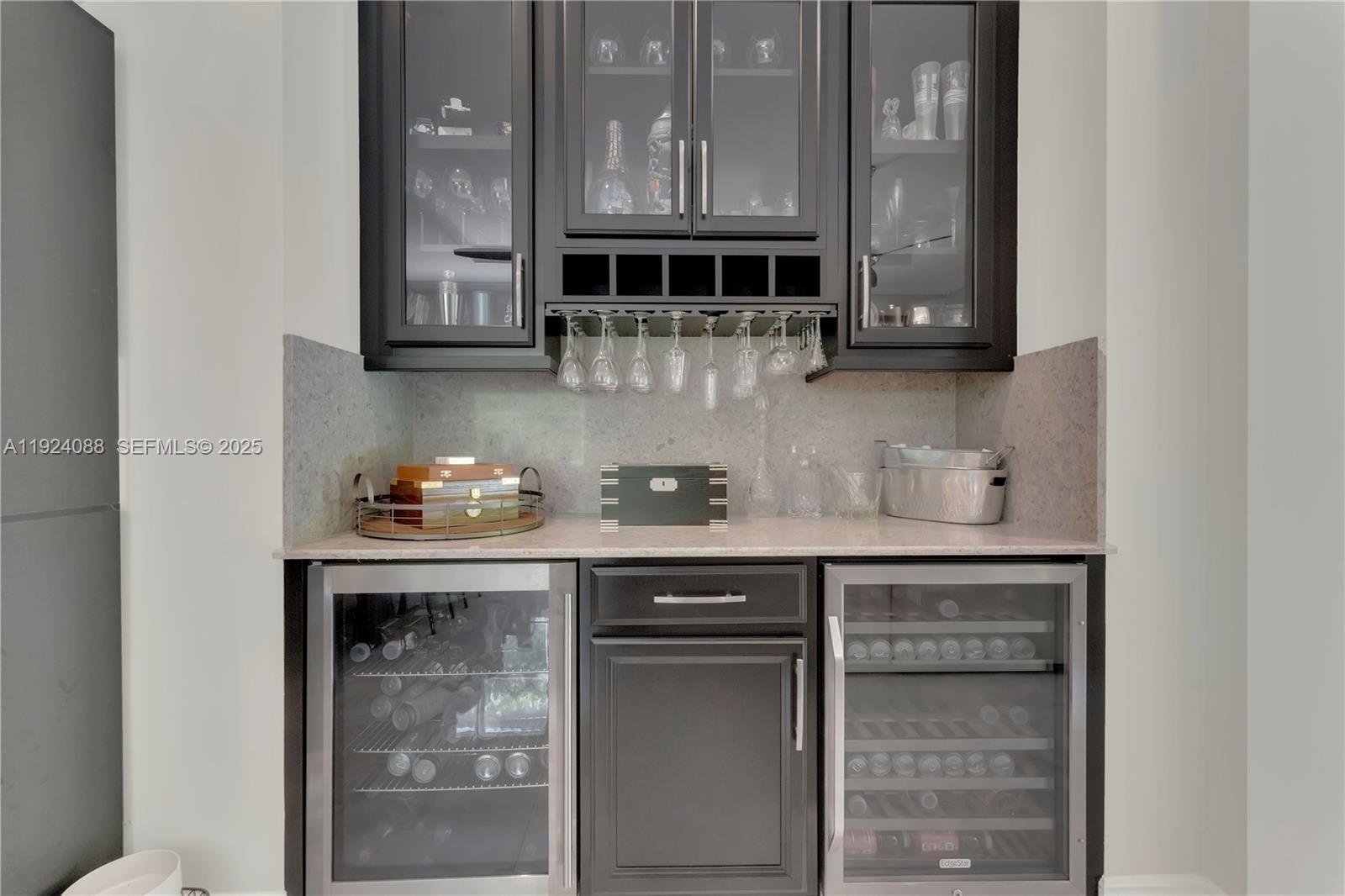 14929 Southwest 176th Terrace Miami, FL 33187 - Photo 19 of 38 a kitchen with granite countertop a sink and cabinets
