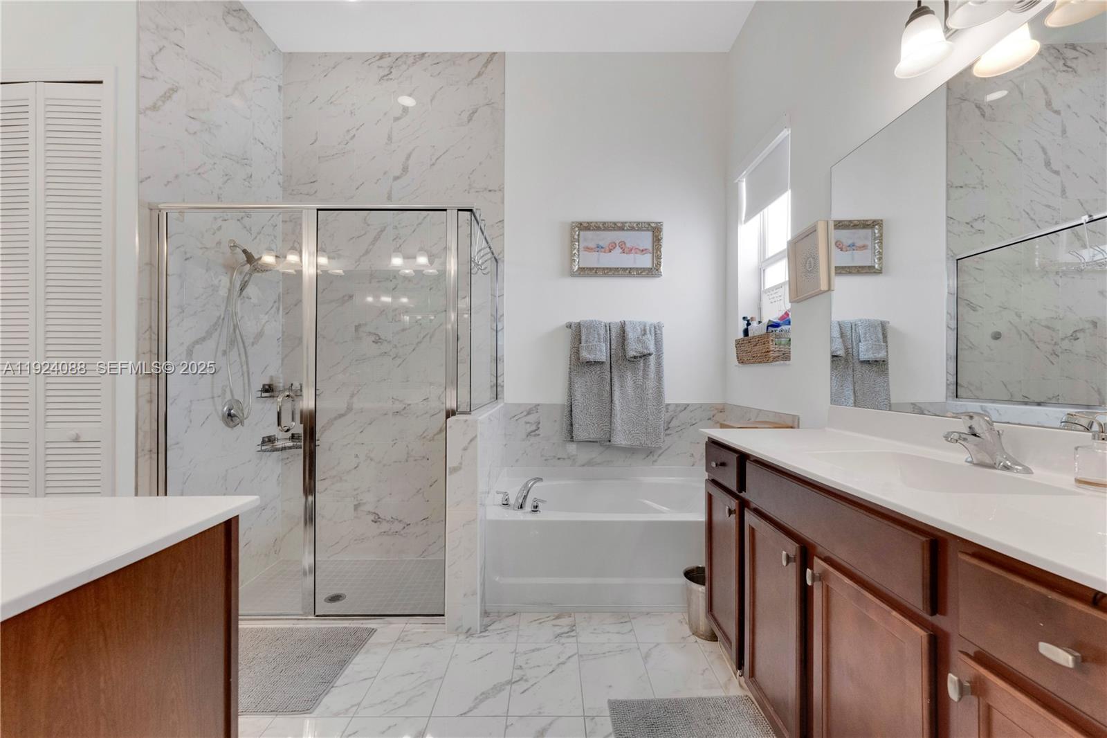 14929 Southwest 176th Terrace Miami, FL 33187 - Photo 22 of 38 a bathroom with a sink a toilet and shower