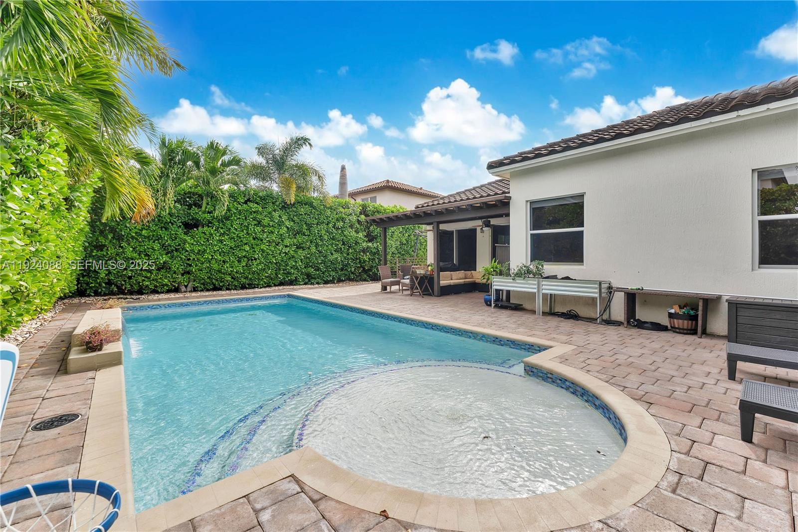 14929 Southwest 176th Terrace Miami, FL 33187 - Photo 25 of 38 a view of a house with swimming pool