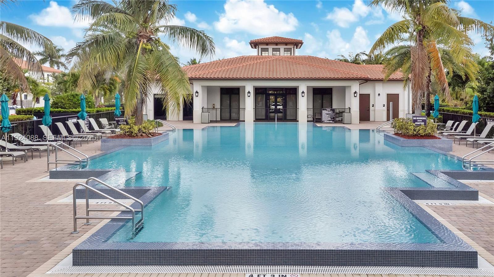 14929 Southwest 176th Terrace Miami, FL 33187 - Photo 34 of 38 front view of a house with swimming pool
