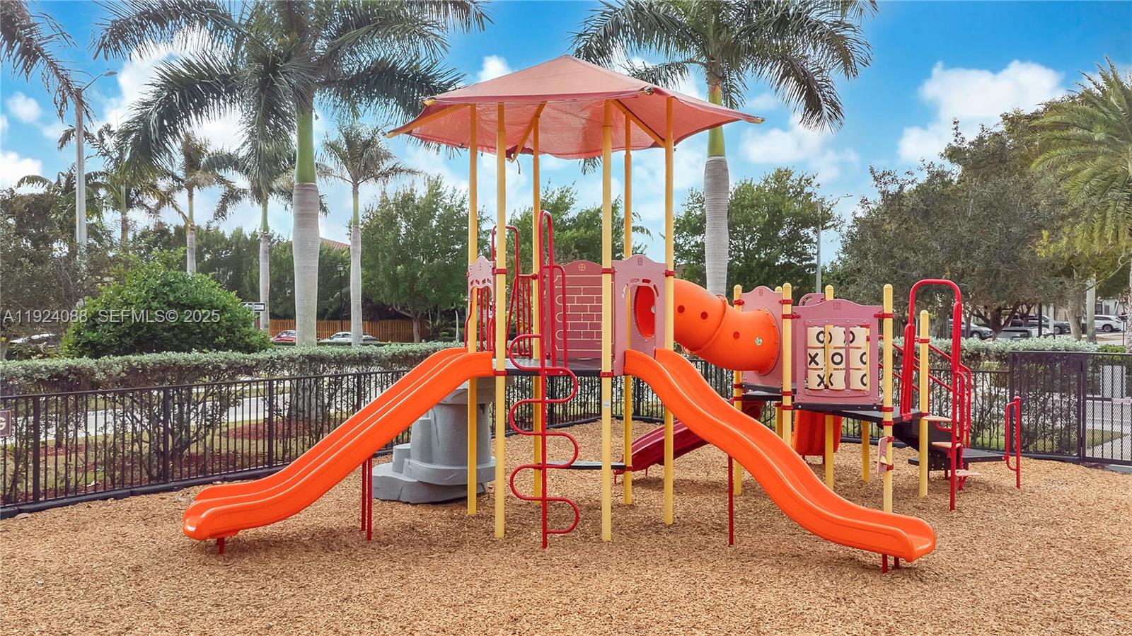 14929 Southwest 176th Terrace Miami, FL 33187 - Photo 35 of 38 an outdoor sitting area with chairs