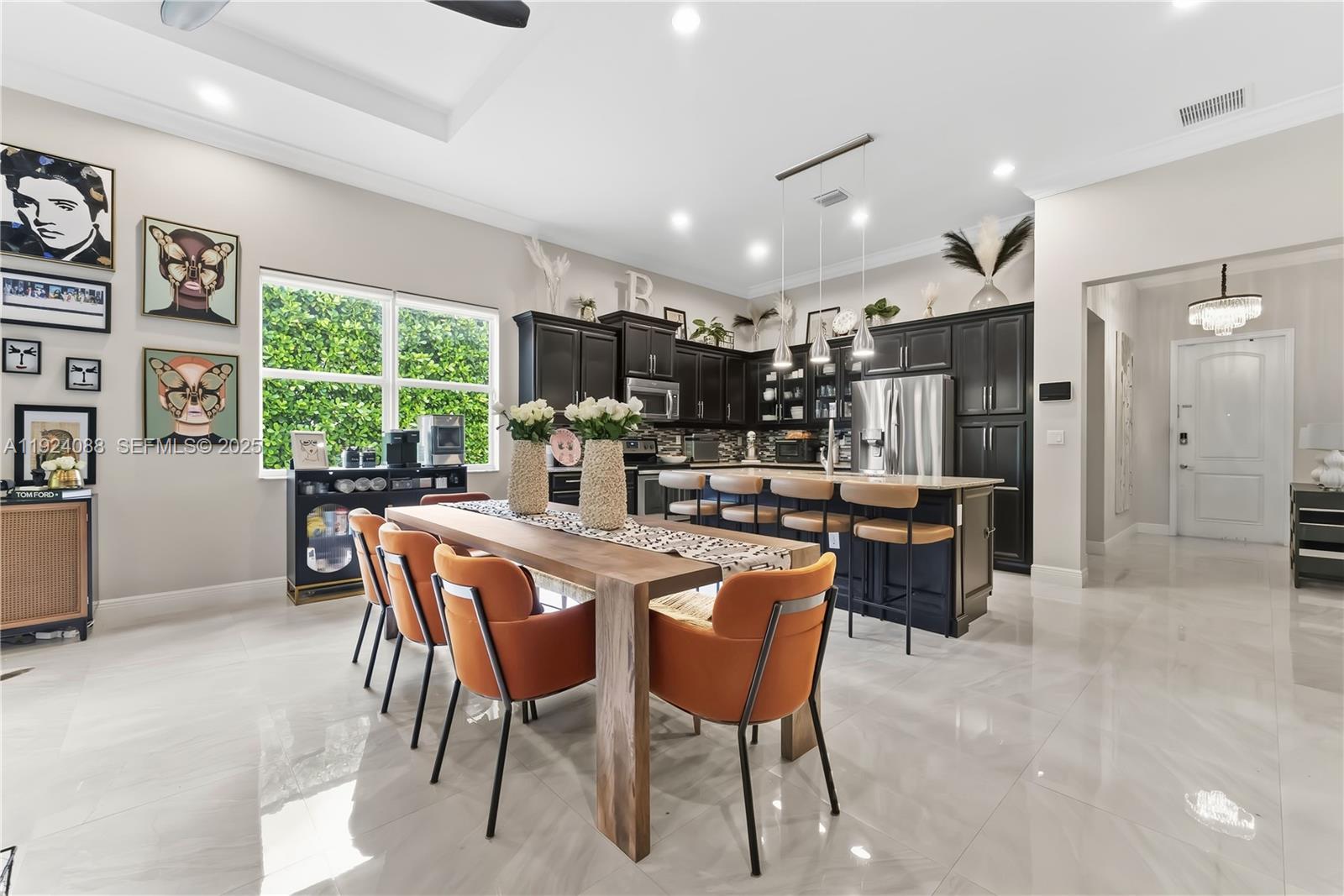 14929 Southwest 176th Terrace Miami, FL 33187 - Photo 6 of 38 a dining area with furniture and a large window
