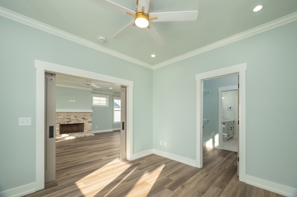 1190 Lee Road Phenix City, AL 36870 - Photo 14 of 52 a view of a hallway with wooden floor and a bathroom
