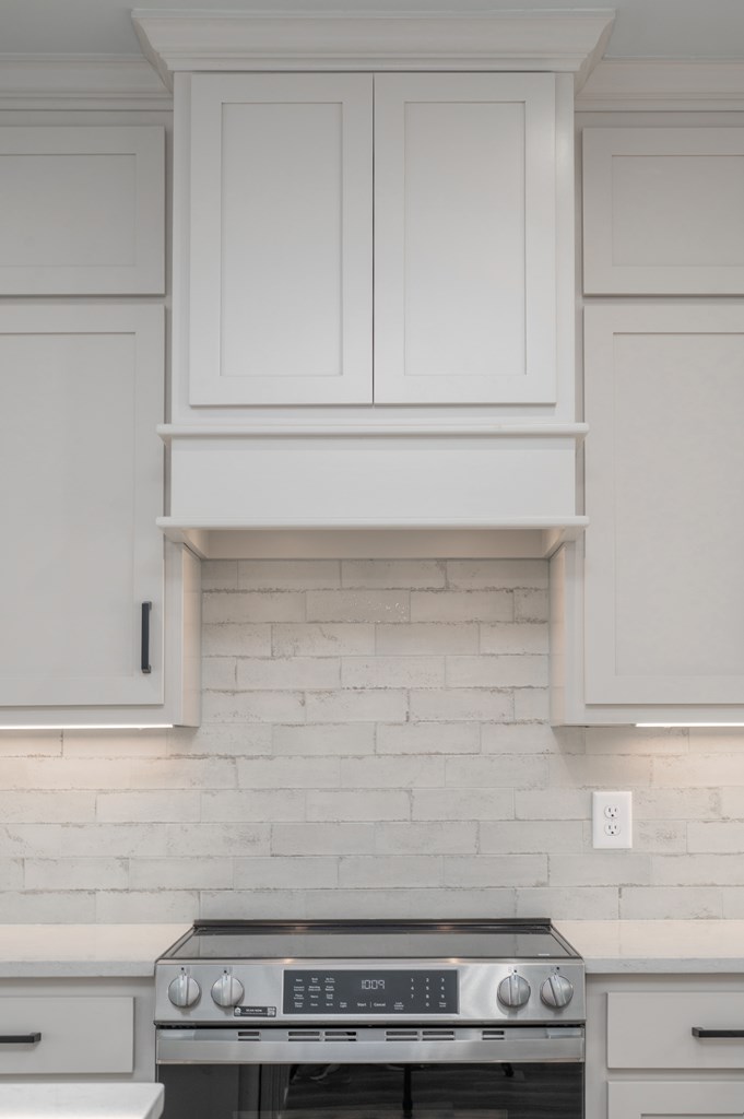 1190 Lee Road Phenix City, AL 36870 - Photo 21 of 52 a stove top oven sitting inside of a kitchen