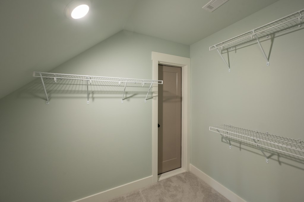 1190 Lee Road Phenix City, AL 36870 - Photo 47 of 52 a view of walk in closet with empty racks