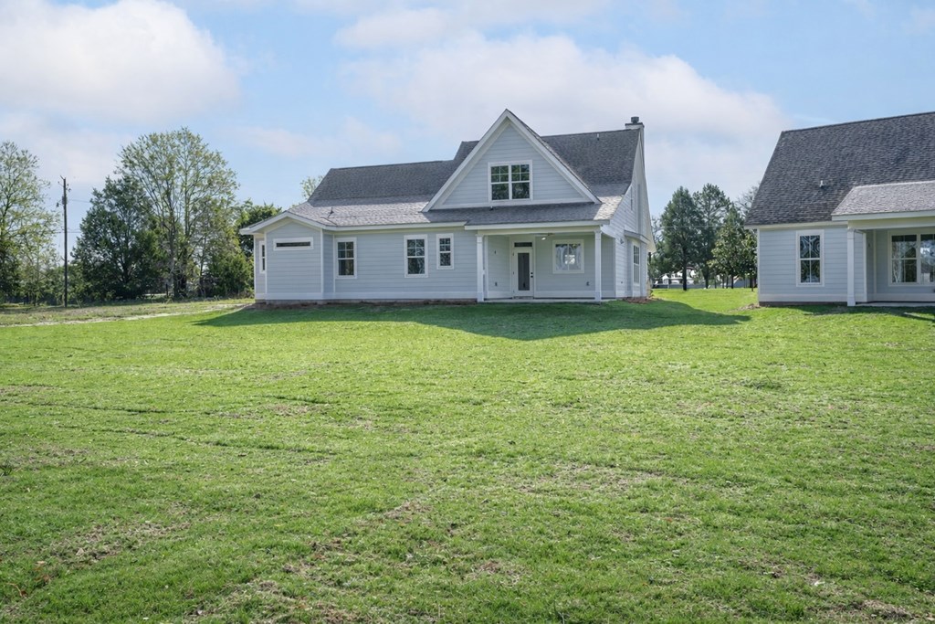 1190 Lee Road Phenix City, AL 36870 - Photo 48 of 52 a front view of a house with garden