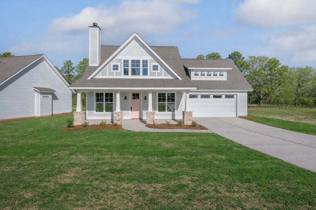 1190 Lee Road Phenix City, AL 36870 - Photo 6 of 52 a front view of a house with a garden