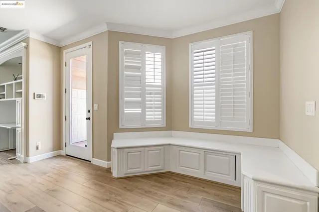 a view of a dining room with furniture and window