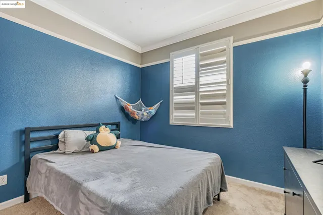a bedroom with a bed and flat screen tv