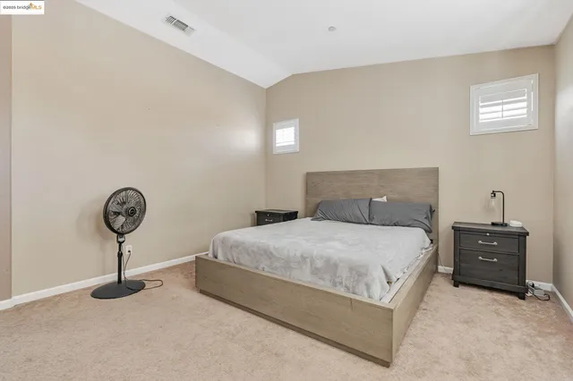 a view of a bedroom with window and closet