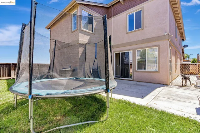 a backyard of a house with seating space
