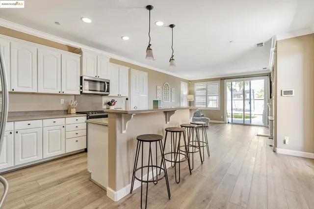 a view of a terrace with a table and chairs