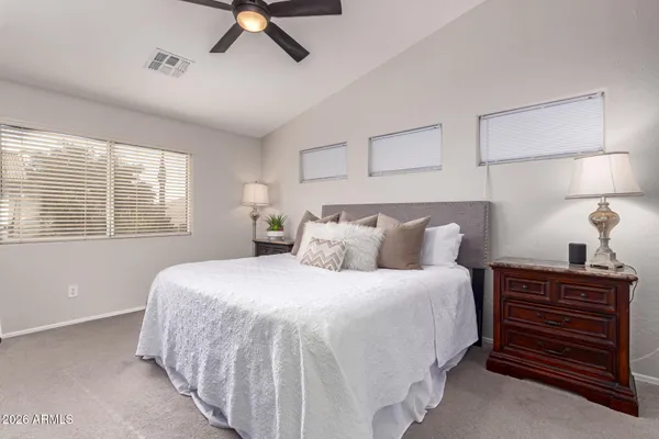 a bedroom with bed and window