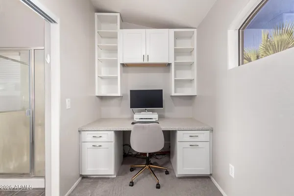 a view of a workspace with furniture