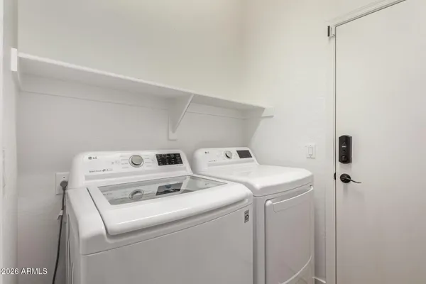 a view of a patio with couches and potted plants