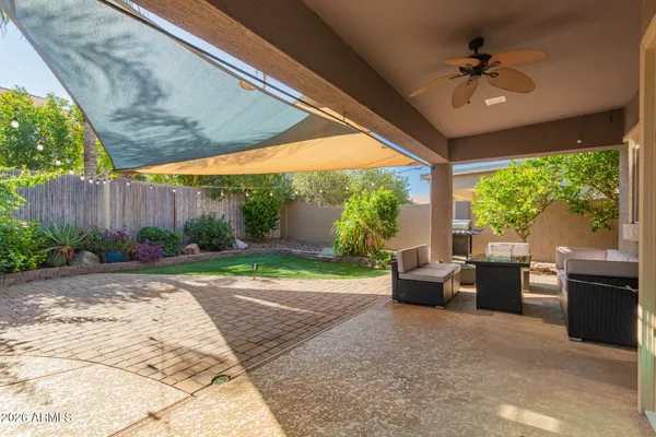 a view of a house with a yard and sitting area