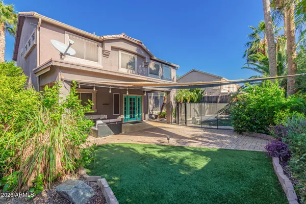 a backyard of a house with lots of green space