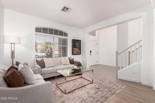 a living room with furniture and a window