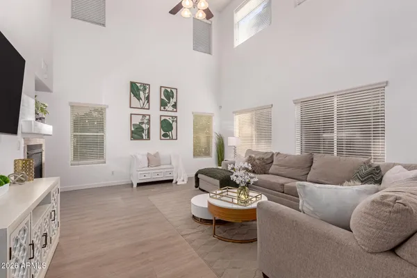 a living room with furniture and a large window
