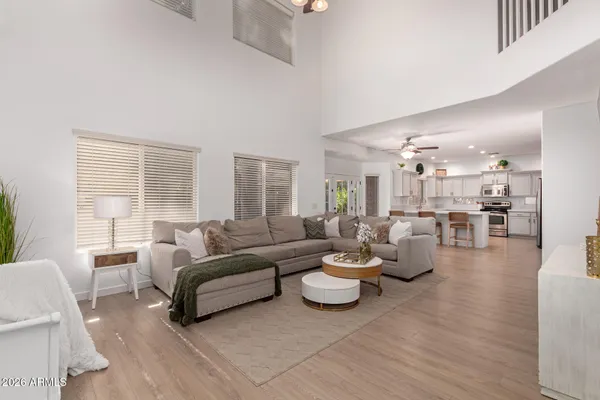 a living room with furniture and a large window