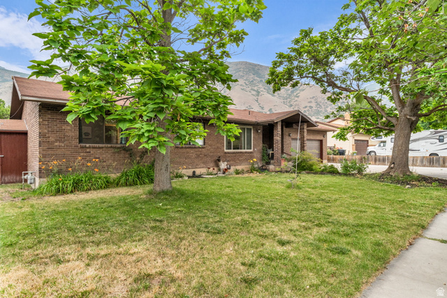 1539 East 450 South Springville, UT 84663 - Photo 2 of 49 Traditional brick exterior with a brown shingle roof