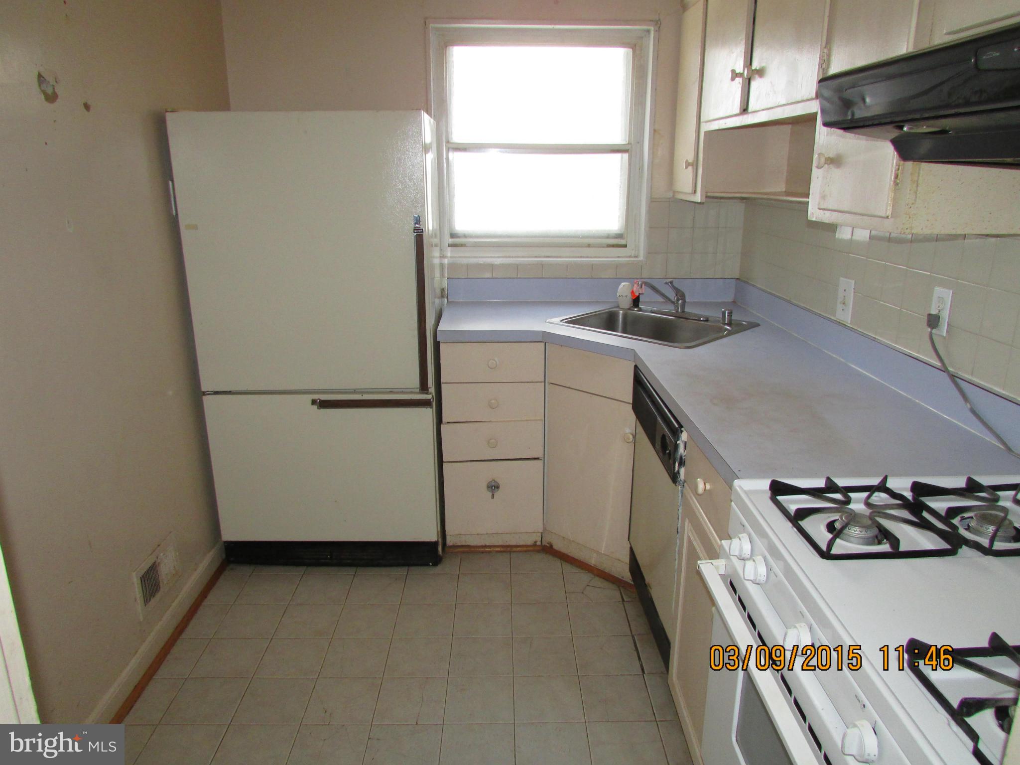 3103 Weller Road Silver Spring, MD 20906 - Photo 6 of 13 a kitchen with a refrigerator and a sink