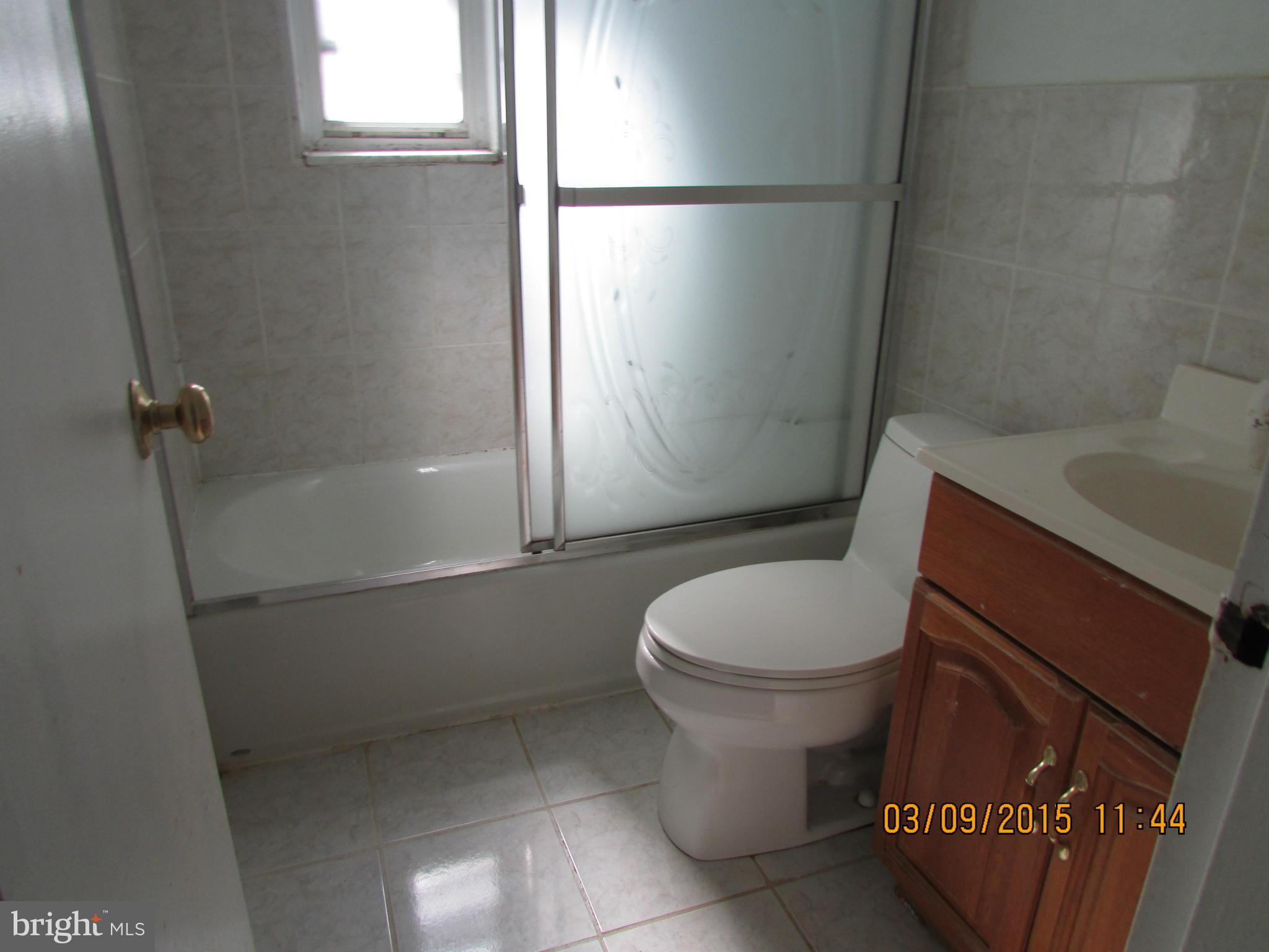 3103 Weller Road Silver Spring, MD 20906 - Photo 7 of 13 a bathroom with a toilet and a shower