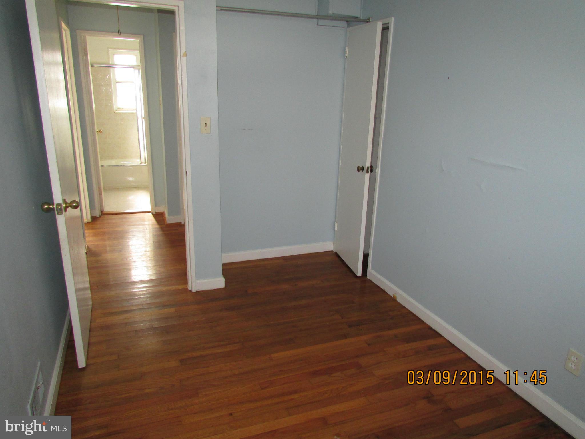 3103 Weller Road Silver Spring, MD 20906 - Photo 9 of 13 an empty room with wooden floor and entrance