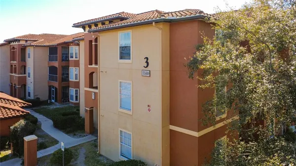 a view of an empty room and wooden floor