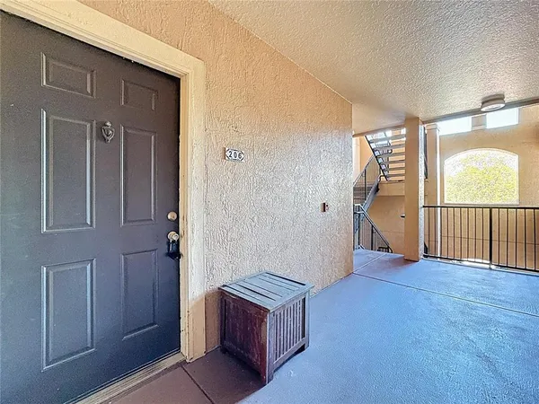 a kitchen with cabinets and refrigerator