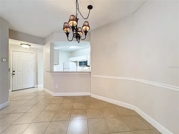 an empty room with fan and a ceiling fan