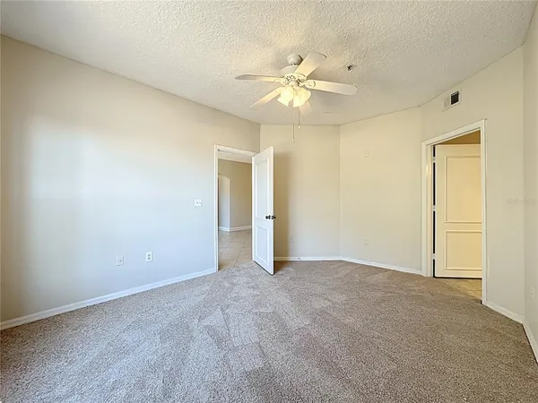 an aerial view of multiple houses with a yard
