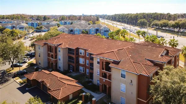 an aerial view of residential houses and outdoor space