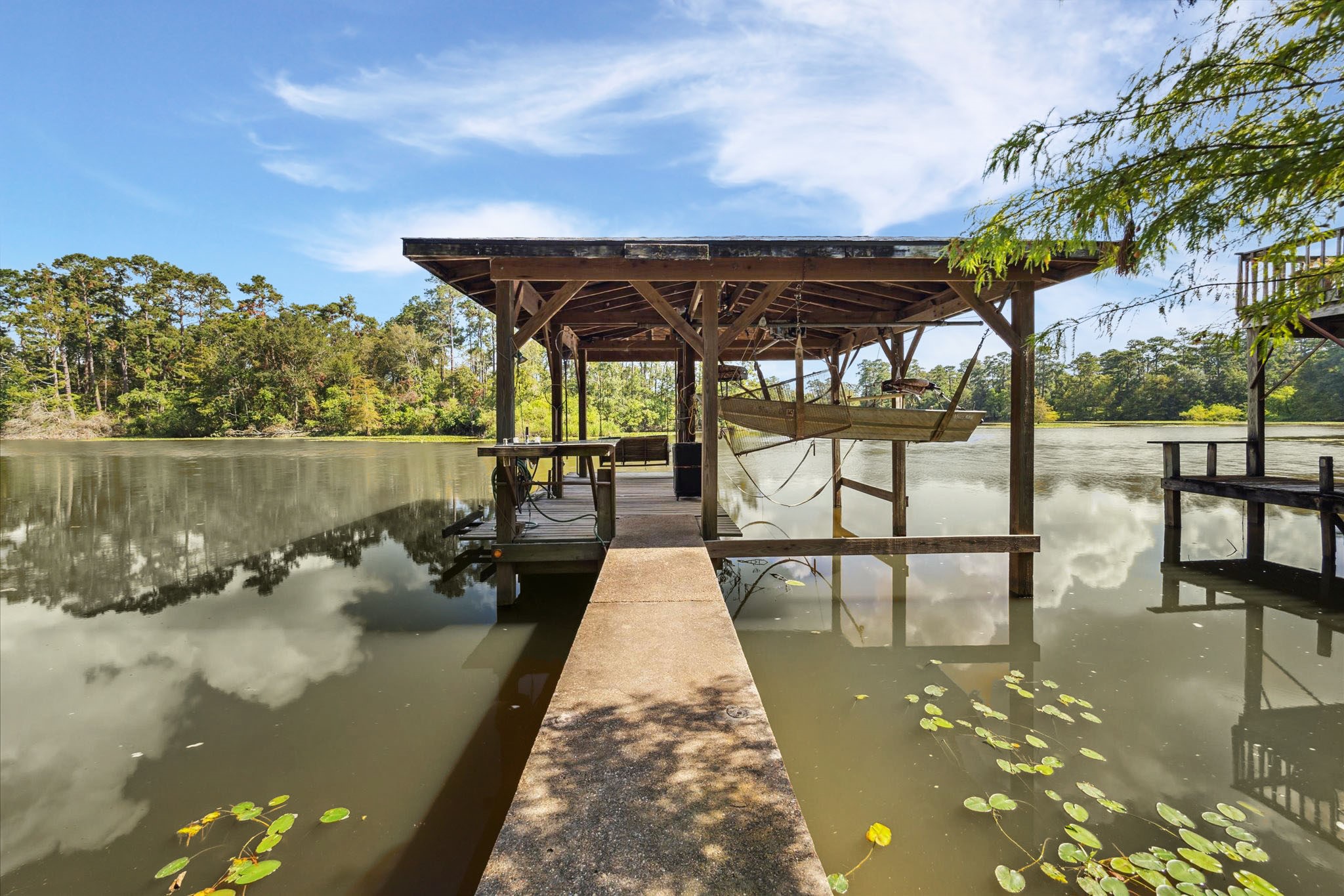 25814 Water Ridge Drive Houston, TX 77336 - Photo 33 of 41 Boat house. Roof Aug 2024. Luce Bayou is wide and deep - no issues getting boat out on water.