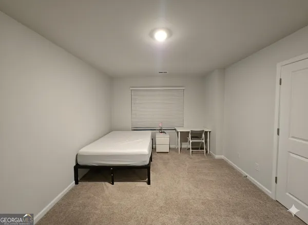 a room with furniture and window