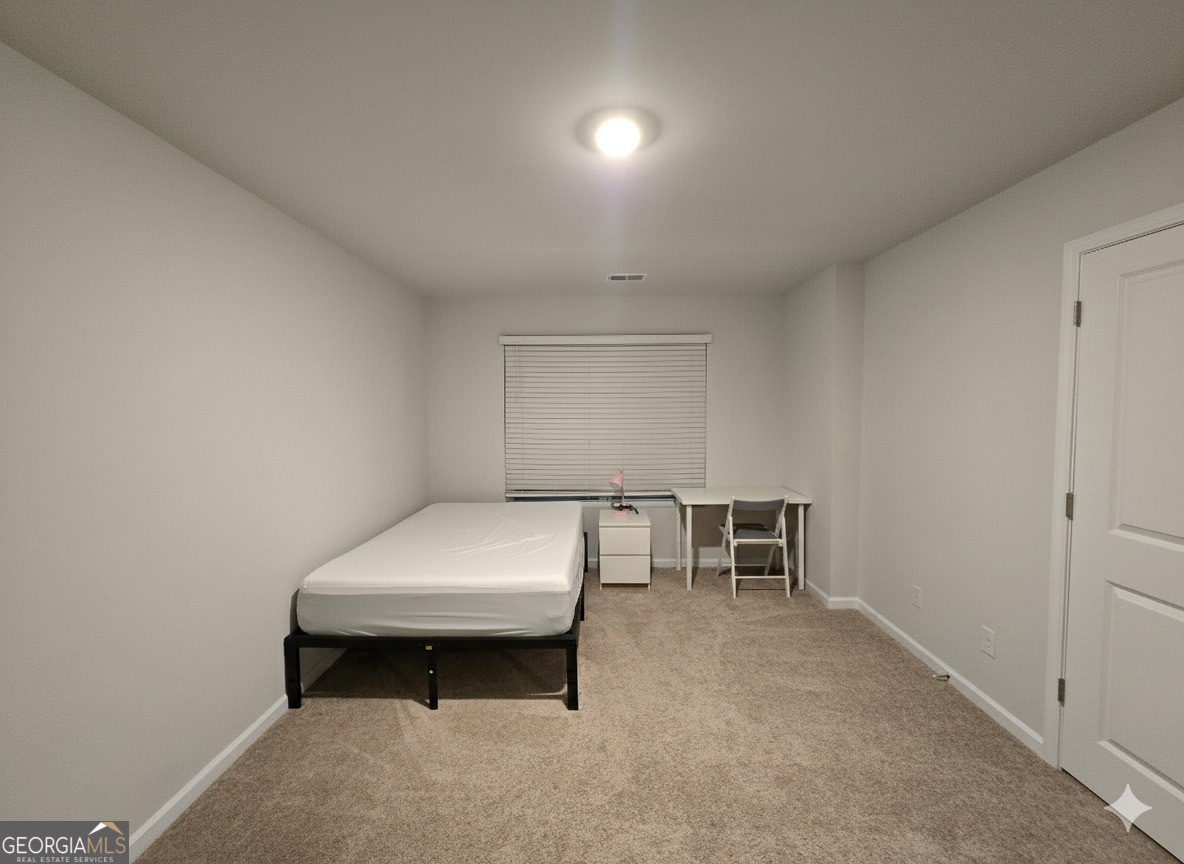 172 Coneflower Road Bloomingdale, GA 31302 - Photo 2 of 10 a room with furniture and window