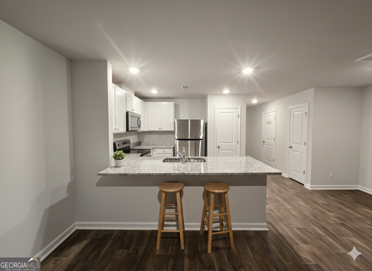 172 Coneflower Road Bloomingdale, GA 31302 - Photo 6 of 10 a kitchen with a table and chairs in it