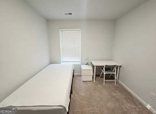 a workspace with furniture and a window