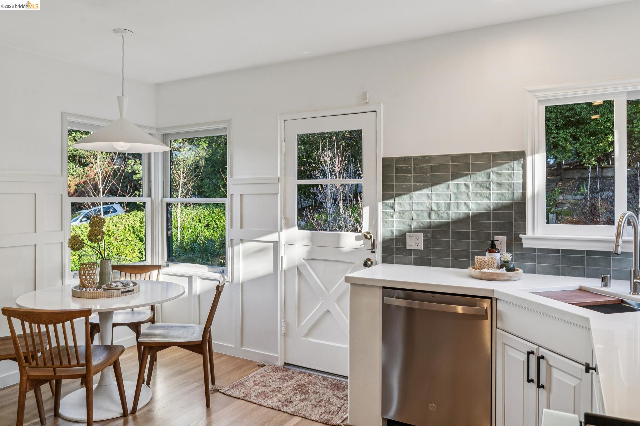 5275 Proctor Avenue Oakland, CA 94618 - Photo 20 of 43 a kitchen with a table chairs and window