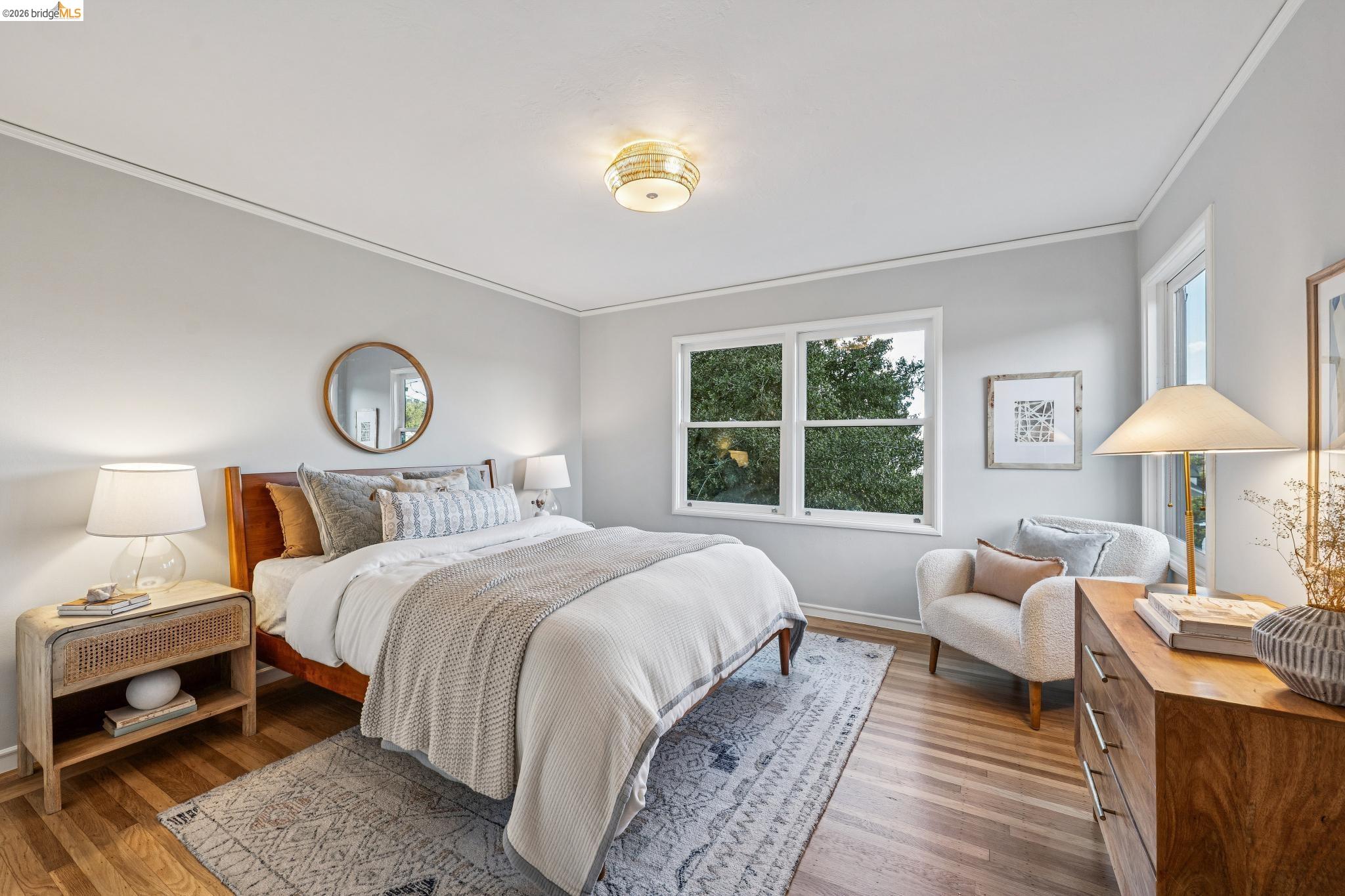 5275 Proctor Avenue Oakland, CA 94618 - Photo 25 of 43 a bedroom with a bed a chandelier and a window