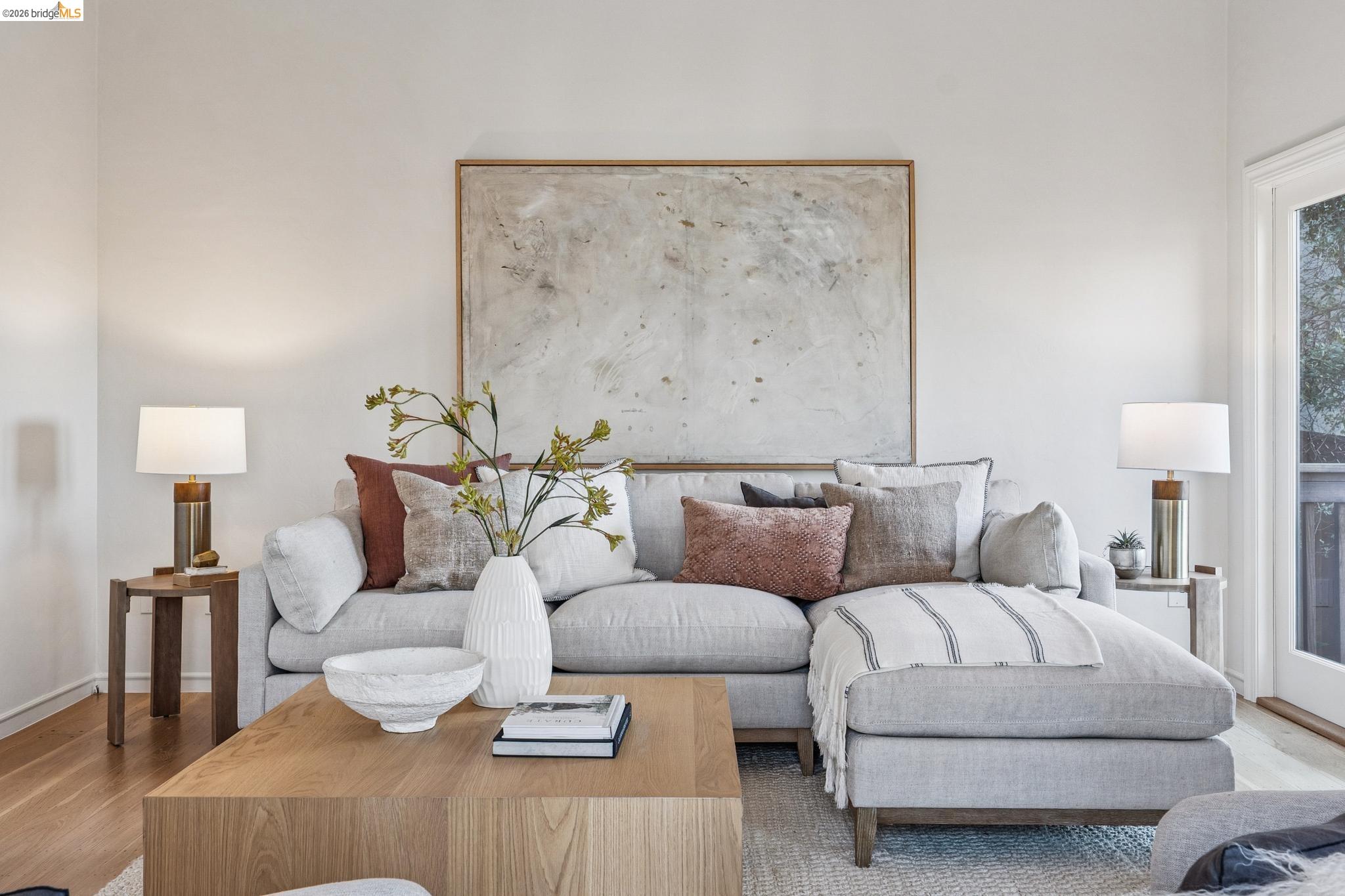 5275 Proctor Avenue Oakland, CA 94618 - Photo 8 of 43 a living room with furniture and a lamp