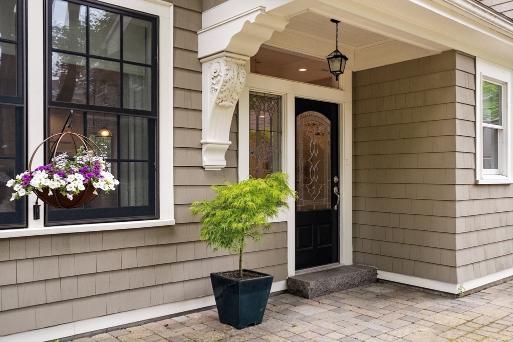 165 Park Avenue, Unit 165 Arlington, MA 02476 - Photo 2 of 32 a potted plant sitting in front of a house