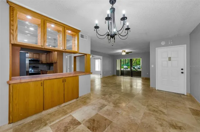 a bedroom with a bed a couch and a window